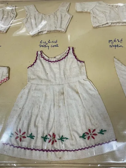 A miniature child's dress from my mother's 1963 journal, complete with delicate floral embroidery at the hem. I am so grateful for the skills and wisdom she passed on to me.
