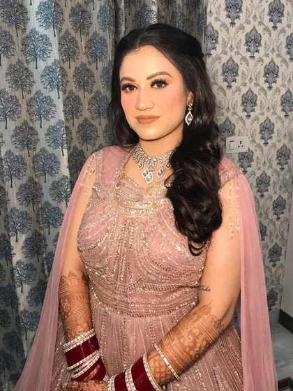 The full look, with her red chooda, shows how you can blend traditional elements with modern reception styling.