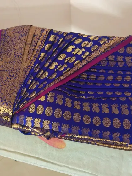 A rich blue and gold silk saree, perfectly box-folded. This showcases my packing skills and knowledge of how to preserve the beauty of a silk saree.