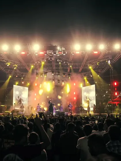 A wide shot of the stage and the massive crowd at the Music and Masala Fest. We bring a full production with stunning visuals to accompany the music.