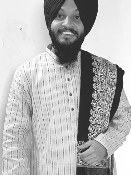 A simple, smiling portrait in black and white.