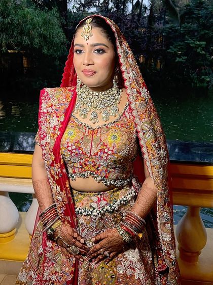 Another angle of the bride with her dupatta, showing how the makeup looks stunning from every perspective.