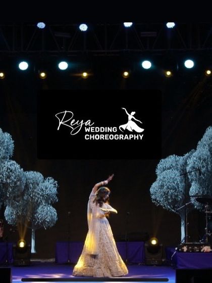 Favorite Capture! A simple, powerful silhouette of the bride on stage, showcasing her form and the grand scale of the production.