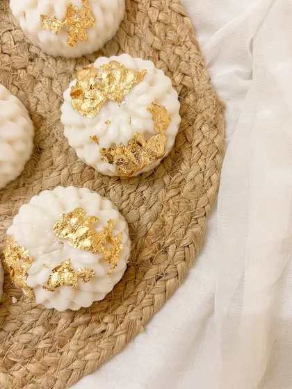 Our gold-leafed decorative candles, perfect for adding a touch of opulence to your Diwali decor. They look stunning on a festive tray or as part of a centerpiece.