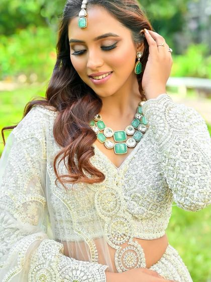 A close-up of our elegant white chikankari-style lehenga. The detailed threadwork is a testament to the quality and craftsmanship of our collection.