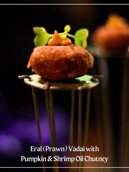 A bite-sized Eral (Prawn) Vadai with Pumpkin & Shrimp Oil Chutney, a creative canapé from our Chettinad menu.