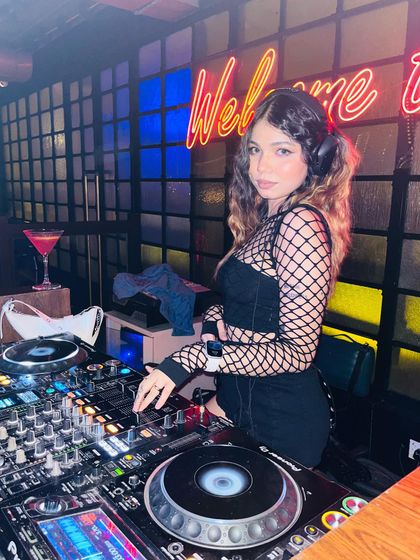 Posing with my gear before the crowd arrives. I always make sure my setup is perfect for the night ahead.