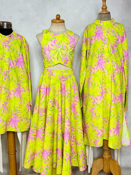 You can even coordinate for the whole family. This shows how the neon leaf print can be used to create multiple kurtas and a lehenga for a fun, unified theme.