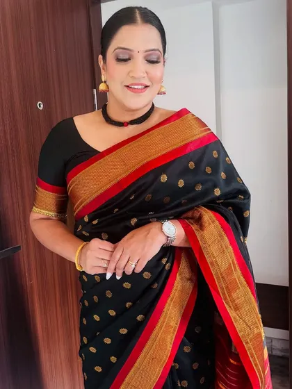 A smiling, candid shot in my black and red border saree.
