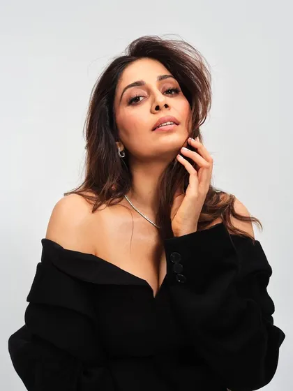 This portrait showcases a soft glam makeup look paired with a voluminous blowout. It's a popular request for both commercial and personal photoshoots, creating a look that is polished, natural, and effortlessly beautiful.