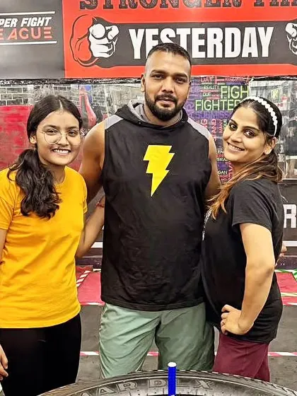 A photo with some of my dedicated female clients. The energy and camaraderie in our gym are unmatched.