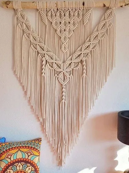 My large bohemian-style wall hangings are designed to be a stunning centerpiece in any room. I use intricate knotting techniques and natural cotton cord to bring a warm, earthy, and artistic feel to your living space.