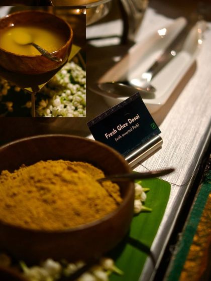 A glimpse into the authentic ingredients of our Chettinad menu. Bowls of fresh ghee and aromatic spice powders are laid out, ready to be used in dishes like the Fresh Ghee Dosai.