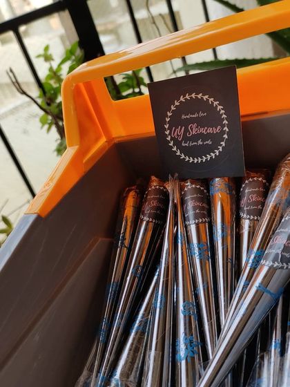 A close-up of the henna cones in the toy truck, with my brand card proudly displayed. It’s all about handmade love.