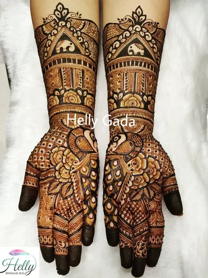 Another beautiful designer mehndi featuring peacocks, elephants, and floral patterns, suitable for any wedding occasion.