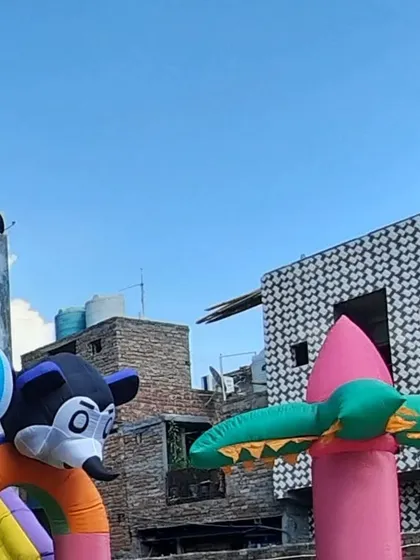 Another angle of the large inflatable structure, showing how the different themed parts come together against the sky. These are designed to be eye-catching from all sides.