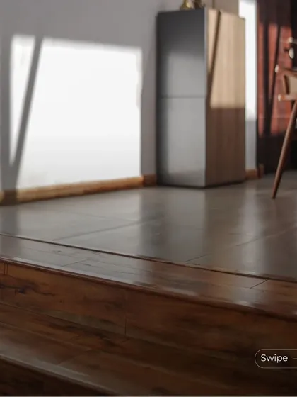 A detail of the split-level transition, showing the seamless flow between the wooden stairs and the tiled floor of the upper level.