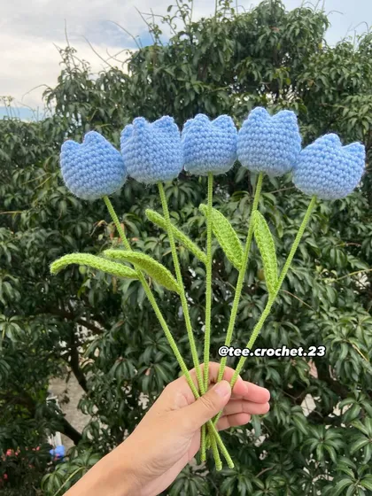 A handful of lovely light blue tulip stems.