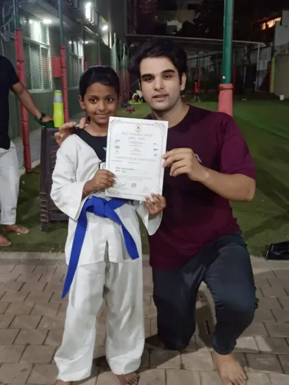 Celebrating a student's promotion to blue belt. This certificate represents months of hard work, discipline, and mastering new techniques.