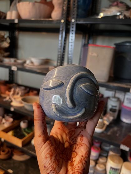 This serene, sculpted face pot has so much personality. It's a wonderful example of how you can bring your ideas to life with clay.