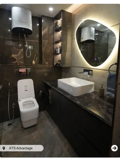 A dark and sophisticated bathroom design. The brown textured tiles, black countertop, and floating vanity with a vessel sink create a bold and masculine look.