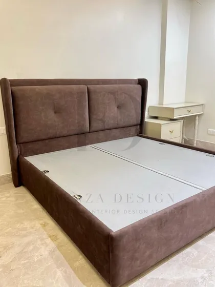 A custom bed with a winged, two-panel headboard in a rich brown fabric. The subtle tufting adds a touch of classic detail to this otherwise modern and comfortable design.