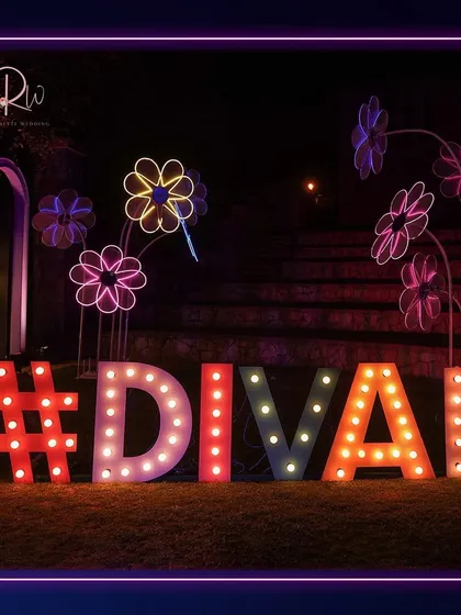 A custom marquee sign with the couple's hashtag, surrounded by neon flower installations. This creates a personalized and vibrant photo opportunity.
