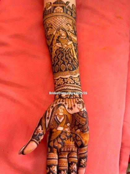 A beautiful portrait of the bride and groom during a wedding ritual, etched with precision on the bride's palm and forearm. This is a memory she will carry forever.