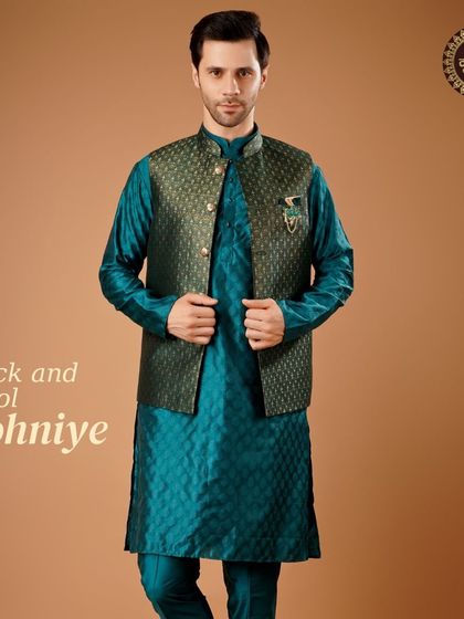 Rock and Dhol Sohniye. A deep teal kurta paired with a matching patterned Nehru jacket, a rich and festive combination.