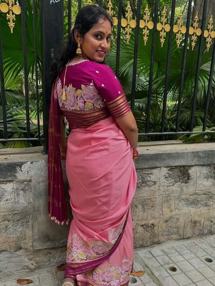 A beautiful back view of the client's saree and the custom-embroidered blouse. The details are just perfect.