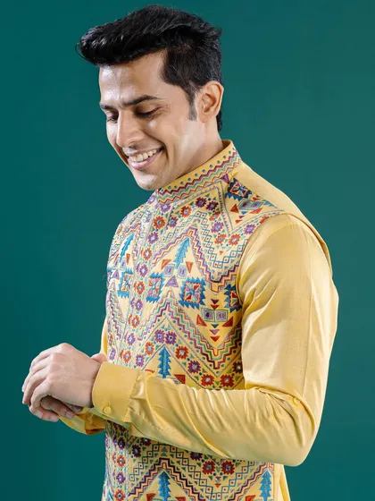 A bright and breezy yellow Jawahar jacket with vibrant, multi-colored embroidery. This piece is an ideal choice for a spring celebration, with a choice for every style and personality.