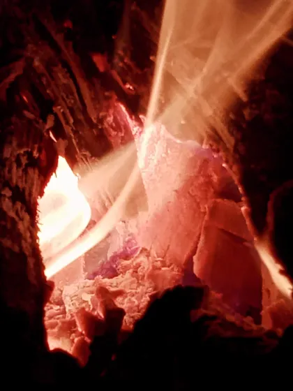 The glowing embers of our campfire. It provided light and warmth for our evening party and dance session.