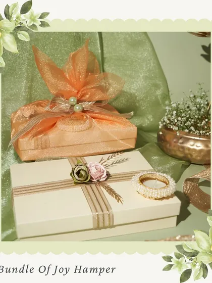 Our 'Bundle of Joy' hamper. This option features elegantly wrapped boxes of sweets and other treats, perfect for a sophisticated and thoughtful gift.