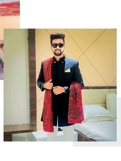 Royal look, practical choice. This client looks regal in a black sherwani with a beautifully embroidered red dupatta, a timeless combination.