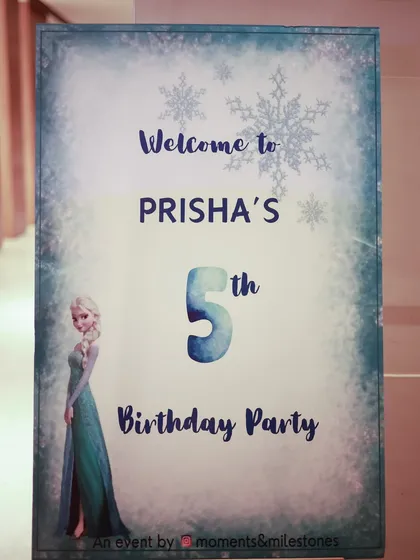 The personalized welcome sign for Prisha's Frozen party, designed with a frosty, snowflake-covered border.