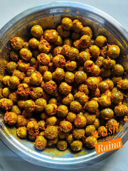 This is my Stuffed Gunda Pickle, also known as Lehsua ka Achaar. Gunda is a sticky berry available only for a short time in the summer. I remove the seed and fill it with a stuffing of grated kairi and masala, a traditional method from Rajasthan and Gujarat.