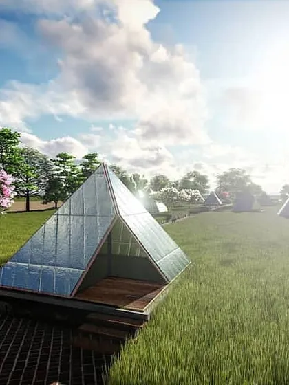 A rendering of the eco-resort 'living pods'. The simple, pyramidal forms with reflective skin are designed to camouflage into the natural setting, mirroring the changing sky and surrounding fields to create a temporary architecture that is one with its environment.