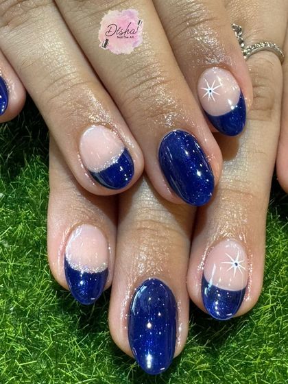 A celestial-inspired design with a deep blue base, silver glitter, and sparkling star accents.
