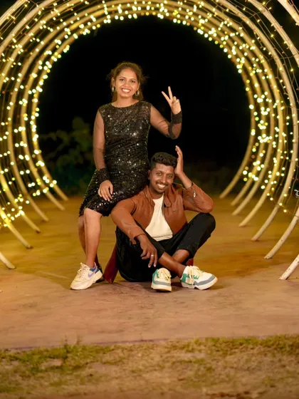 A fun and playful pose in the fairy light tunnel. We make sure you have a great time during your all-inclusive photoshoot.