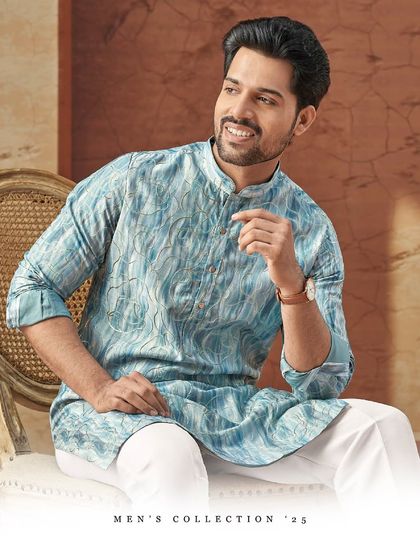 A refreshing sky blue kurta with a subtle, abstract pattern. This piece is perfect for adding a touch of cool elegance to your festive wardrobe.
