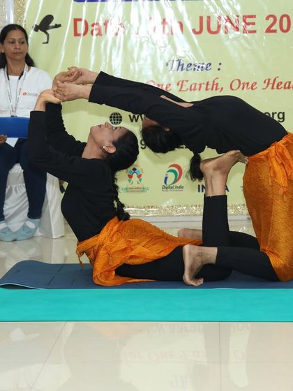 A serene yet challenging pair yogasana pose, combining a backbend with a stable base. This demonstrates the balance between effort and surrender that is central to yoga.