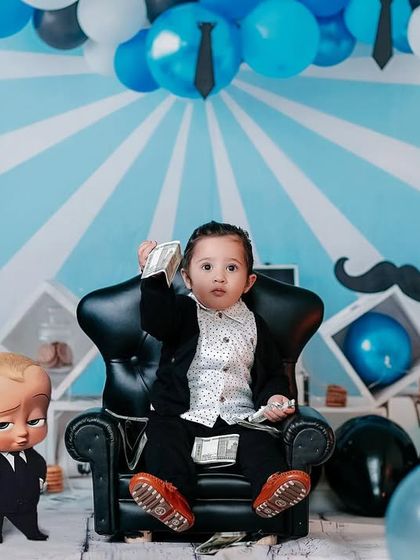Nobody puts Baby in a corner. This boss baby is making it rain with hundred-dollar bills in his themed studio session.