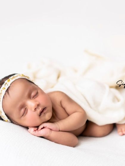 A duplicate of image 17, a classic and timeless pose for any newborn.