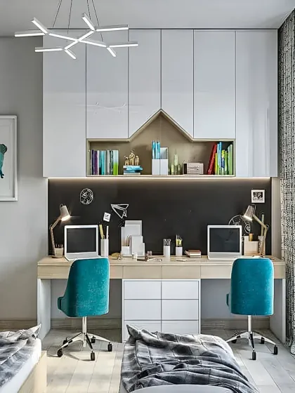 This shared study room features a long desk for two, complete with individual laptops and task lighting. The wall-mounted cabinets and open shelving provide plenty of storage for books and school supplies.