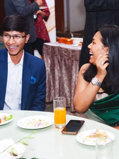 Sharing a laugh with a guest. The best magic is a shared experience, and a smile is the universal sign of a moment well spent.