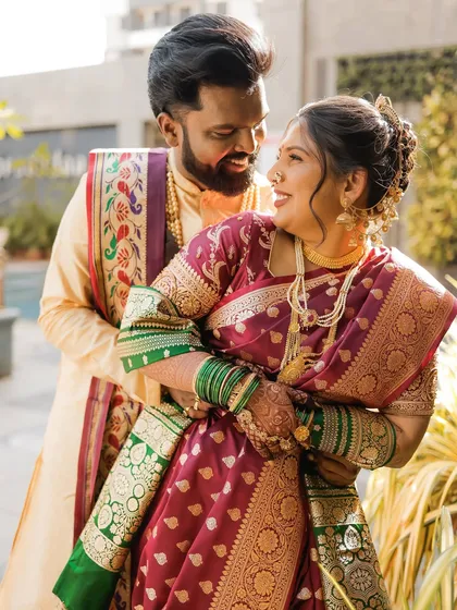 A beautiful moment between this Maharashtrian couple. The bride's soft and natural airbrush makeup glows in the sunlight, highlighting her happiness.