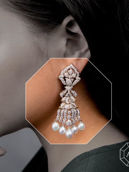 These intricately crafted long diamond earrings with South Sea pearls are an ideal choice for the bridal trousseau, exuding timeless sophistication and grace.