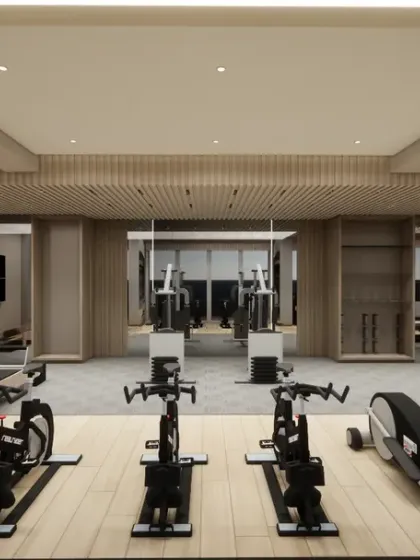 A frontal view of the home gym, showcasing the organized layout of cardio and strength training equipment. The clean design and ample space make for an inviting workout environment.