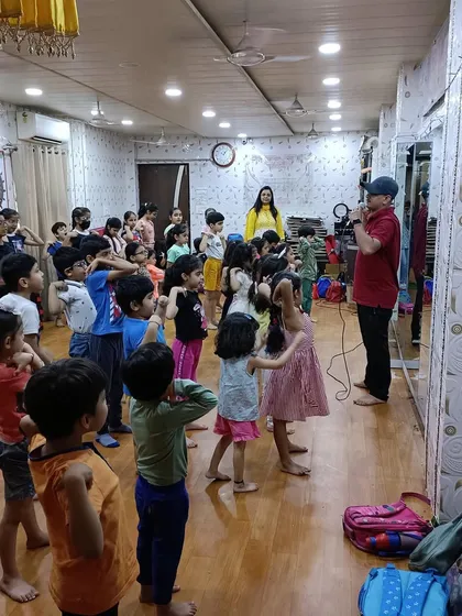 Another angle of our Taekwondo session, showing the children mirroring the instructor's movements. This demonstrates the discipline and coordination taught in our martial arts for kids program.