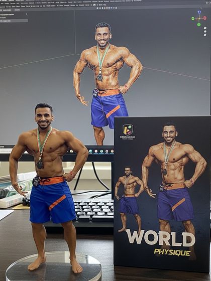 The final product next to the digital design. This 'World Physique' figure is a testament to reaching a high level in the sport and a symbol of the physique goals we can work towards together.